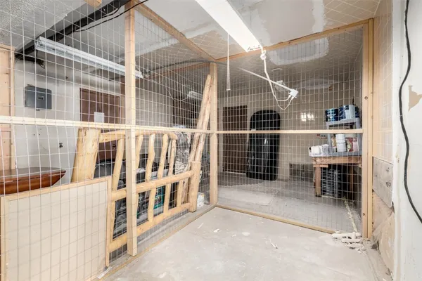 a picture of a bench in front of a wall