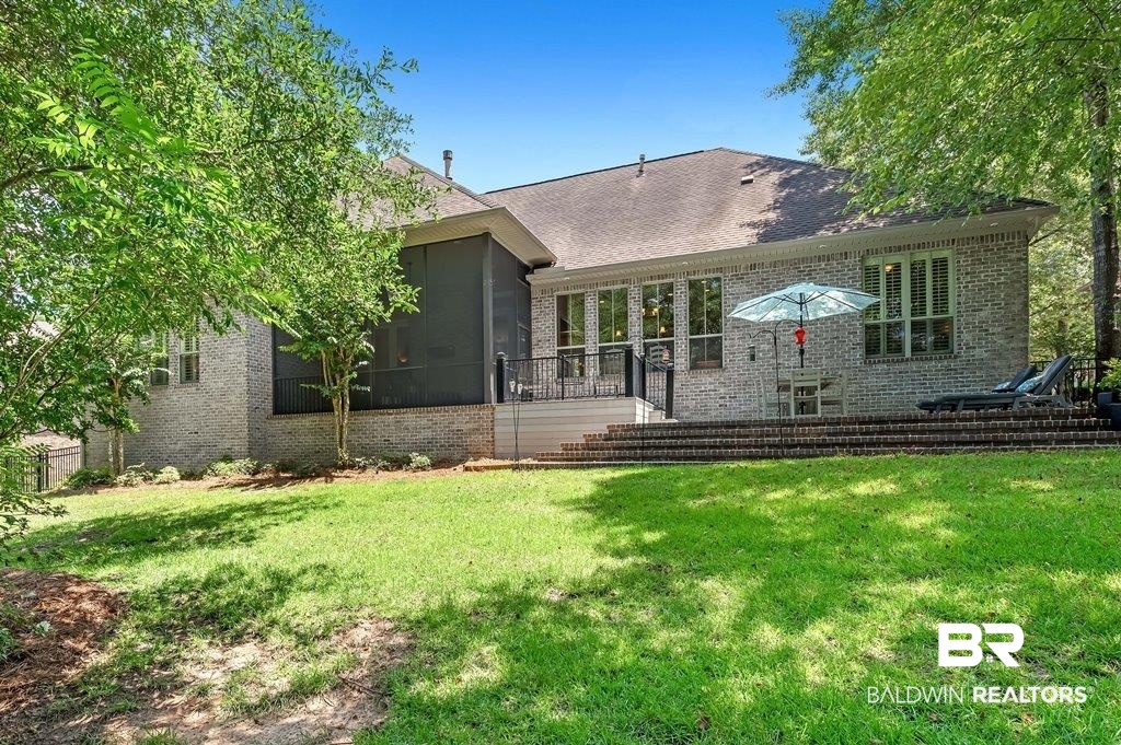 30014 Dolive Ridge Daphne, AL 36527 - Photo 55 of 57 Back of property with a sunroom and a yard