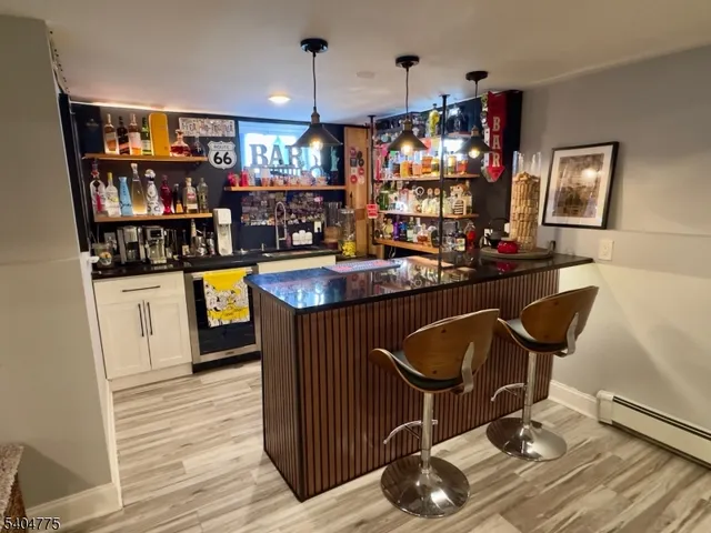 a room with lots of wooden furniture and appliances