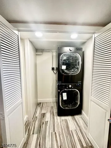 a view of a hallway with washer and dryer