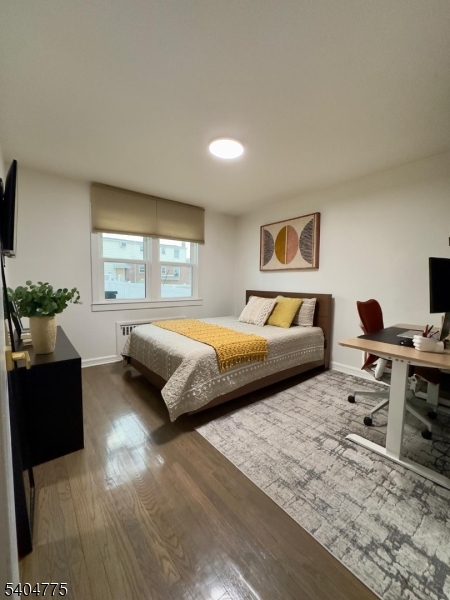 120 Union Street Lodi, NJ 07644 - Photo 6 of 18 a bedroom with a large bed and a couch