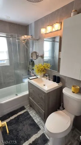 a bathroom with a toilet a sink and a bathtub
