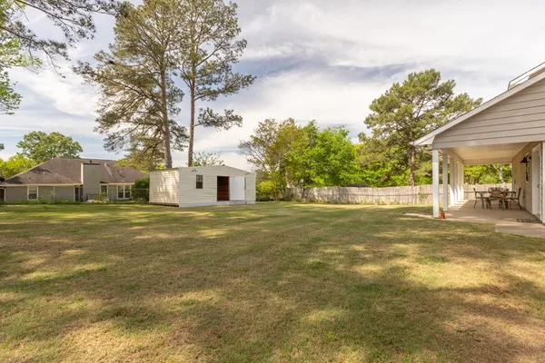 a view of a street with a building in the background