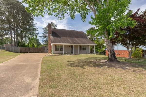 a house with trees in front of it