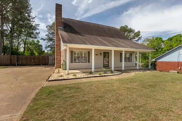a house with trees in the background