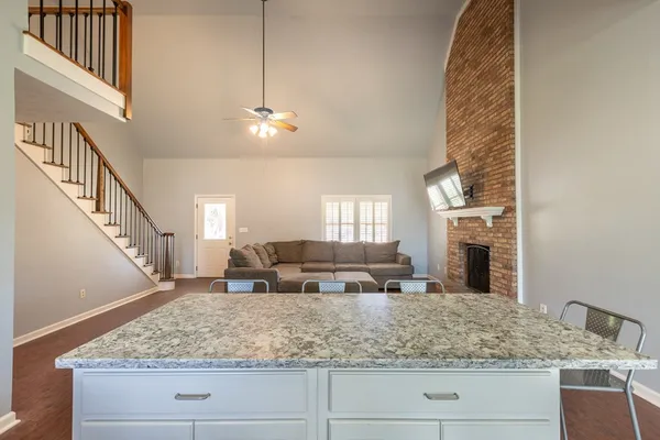a view of living room with fireplace and couch