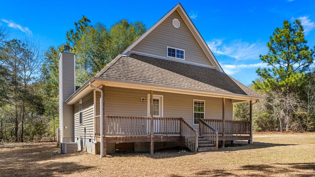 497 George Cannon Road Box Springs, GA 31801 - Photo 2 of 35 rear of cabin w/ full length porch