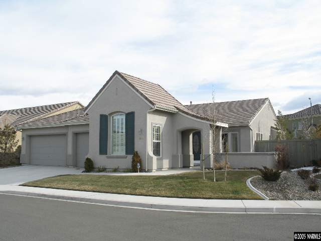 9918 Bridge View Drive Reno, NV 89521 - Photo 1 of 6 a view of a white house next to a yard