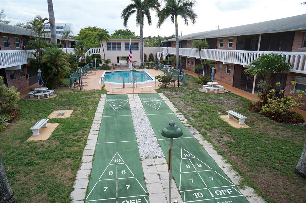 160 Northeast 8th Avenue, Unit 25B Hallandale Beach, FL 33009 - Photo 12 of 35 a view of swimming pool with a patio