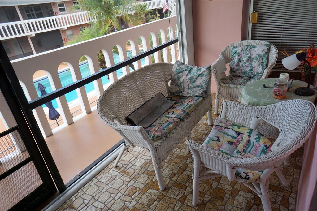 160 Northeast 8th Avenue, Unit 25B Hallandale Beach, FL 33009 - Photo 14 of 35 a living room with furniture and a window