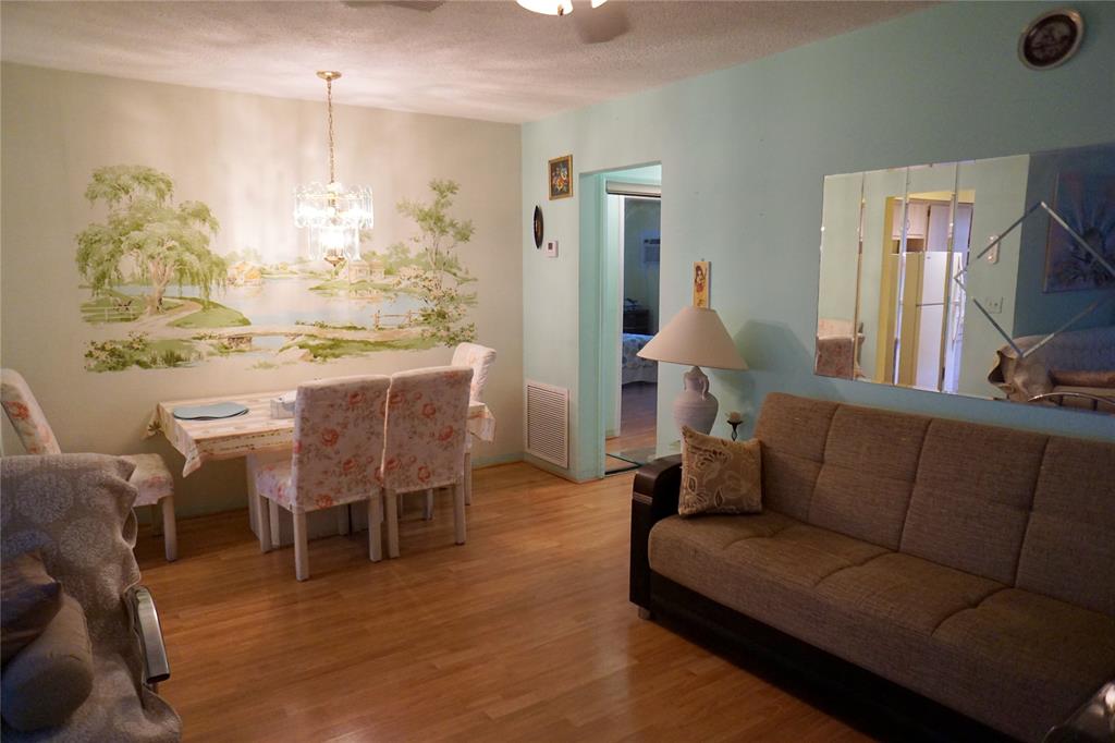 160 Northeast 8th Avenue, Unit 25B Hallandale Beach, FL 33009 - Photo 15 of 35 a living room with furniture and a large window