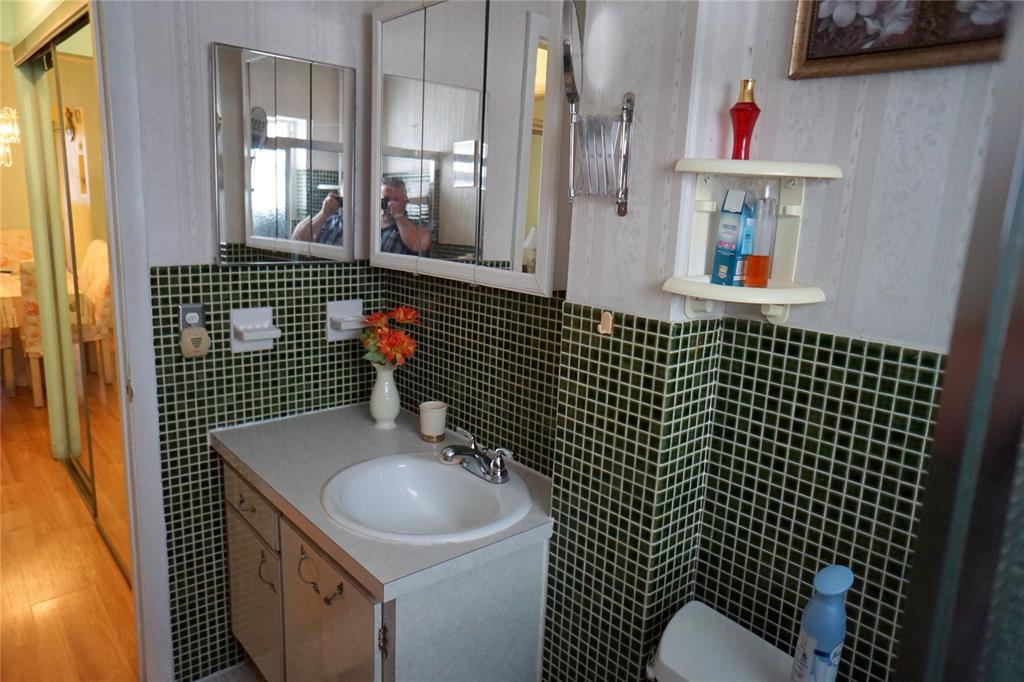 160 Northeast 8th Avenue, Unit 25B Hallandale Beach, FL 33009 - Photo 29 of 35 a bathroom with a sink toilet and shower