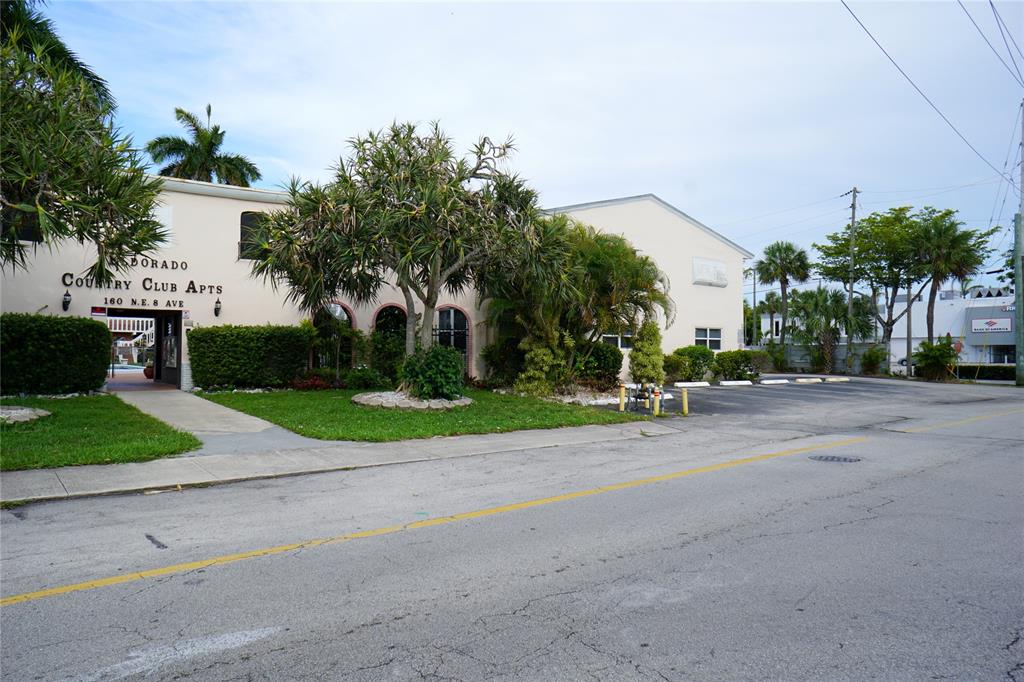 160 Northeast 8th Avenue, Unit 25B Hallandale Beach, FL 33009 - Photo 6 of 35 a view of a park with palm trees