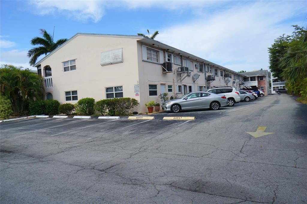 160 Northeast 8th Avenue, Unit 25B Hallandale Beach, FL 33009 - Photo 7 of 35 a view of a street with cars