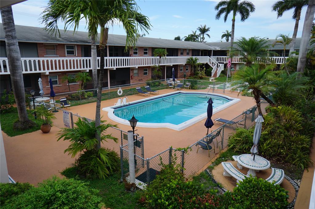 160 Northeast 8th Avenue, Unit 25B Hallandale Beach, FL 33009 - Photo 10 of 35 an aerial view of house with outdoor space and swimming pool