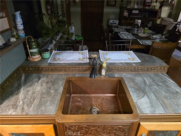 a view of living room with furniture and floor to ceiling window