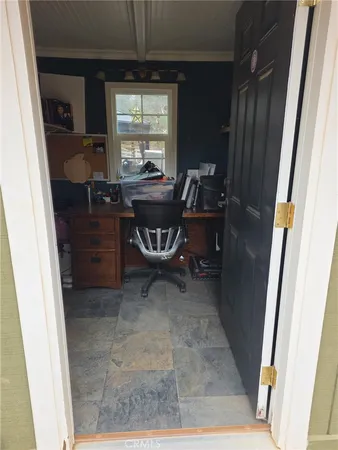 a workspace with furniture and window