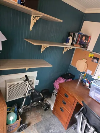 a room with furniture and gym equipment