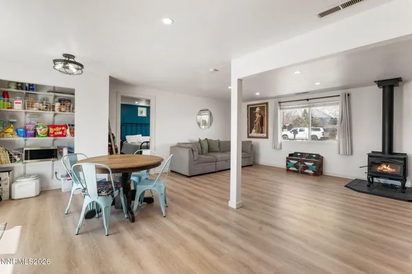 a kitchen with a table and chairs in it