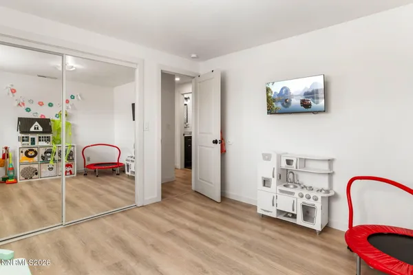 a bedroom with a bed and a dresser