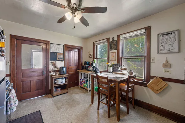 a view of a dining room with furniture window and outside view
