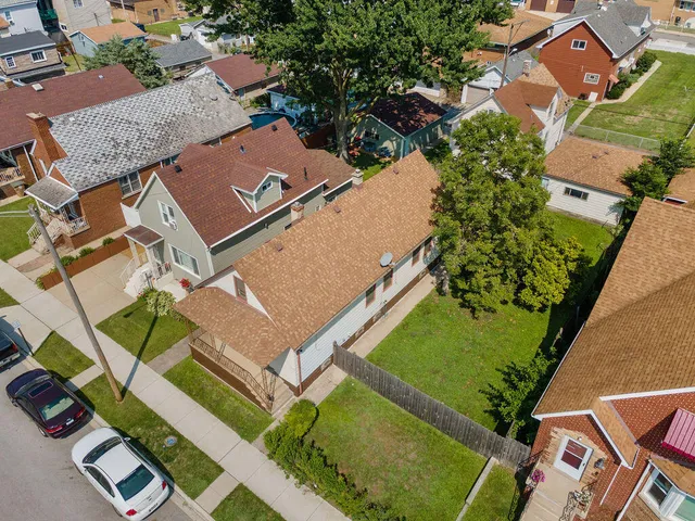 an aerial view of a house with a garden