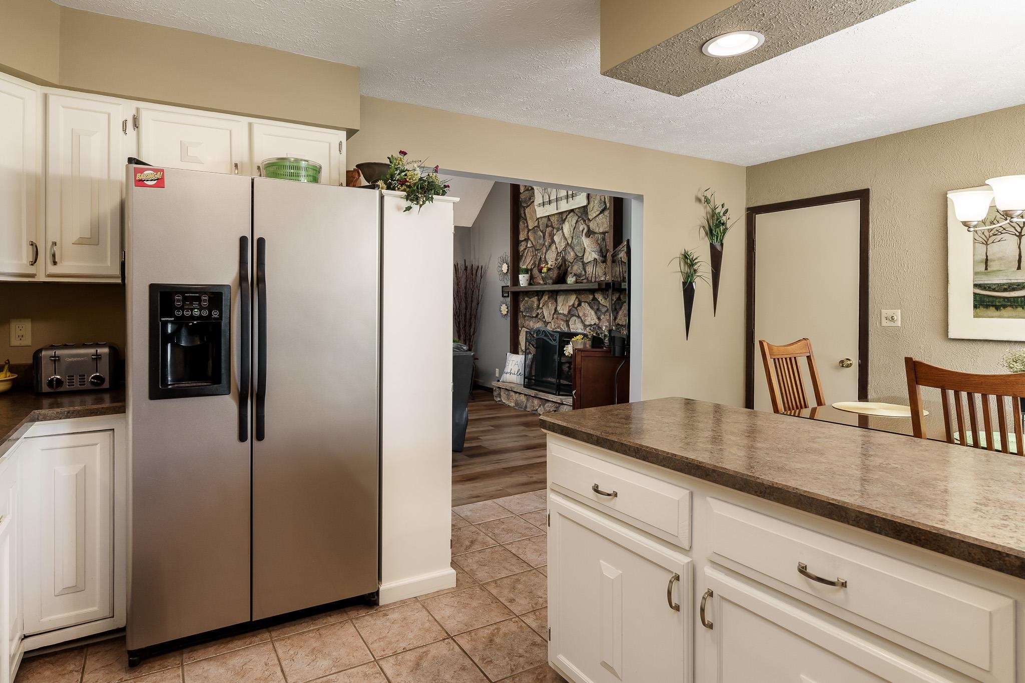 11748 Cedarbrook Road Roscoe, IL 61073 - Photo 17 of 50 a kitchen with refrigerator and window