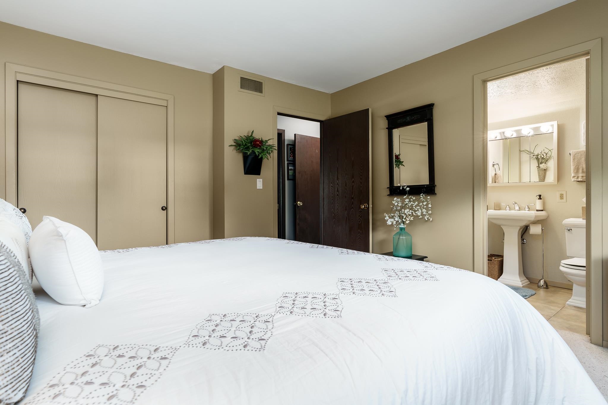 11748 Cedarbrook Road Roscoe, IL 61073 - Photo 20 of 50 a bedroom with a bed and a large mirror