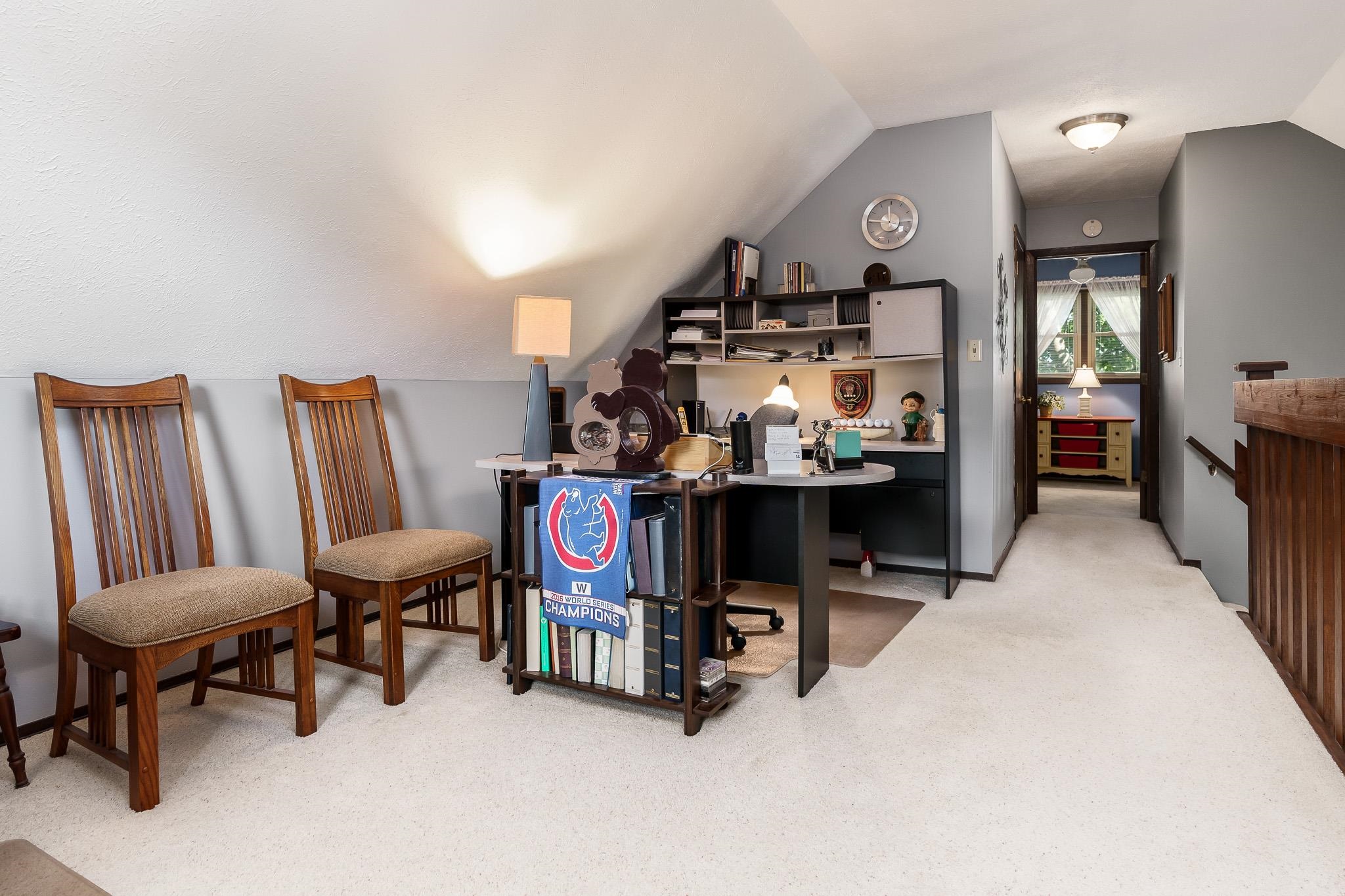 11748 Cedarbrook Road Roscoe, IL 61073 - Photo 26 of 50 a bedroom with furniture and a chair
