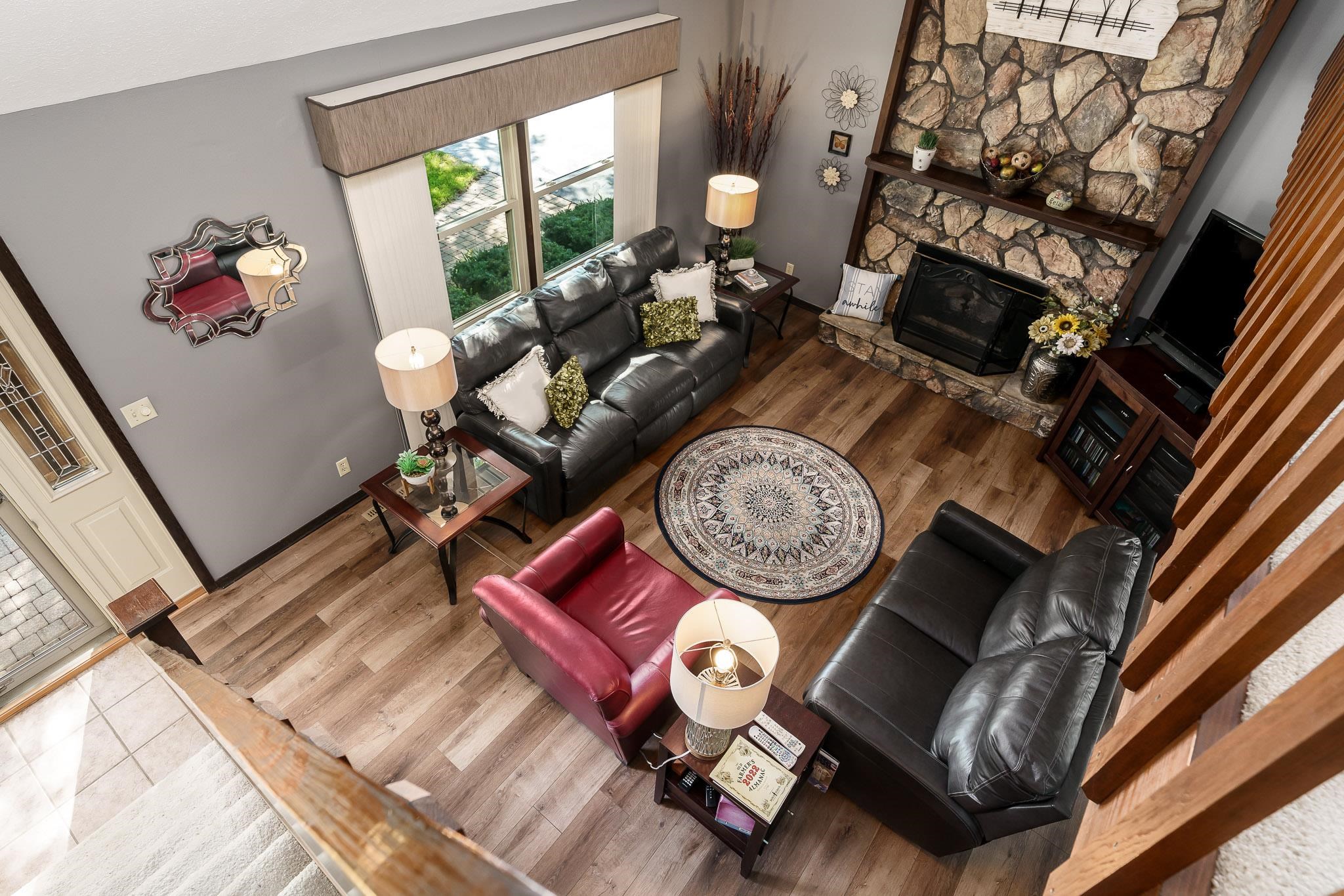 11748 Cedarbrook Road Roscoe, IL 61073 - Photo 27 of 50 a living room with furniture and a fireplace