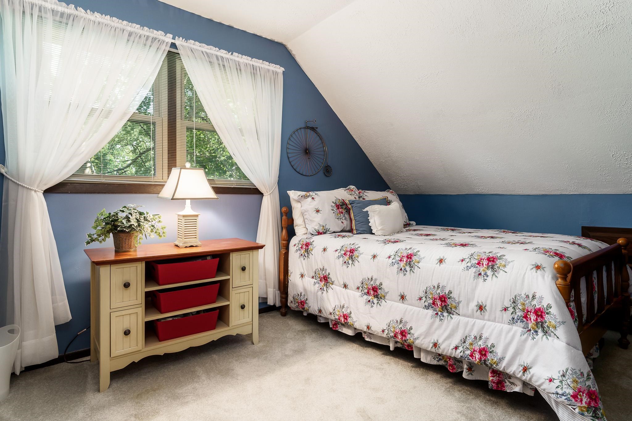 11748 Cedarbrook Road Roscoe, IL 61073 - Photo 28 of 50 a bedroom with a bed and a window