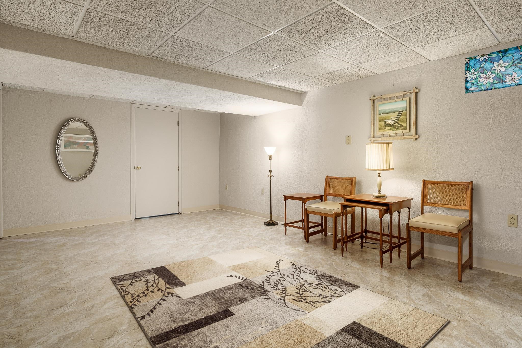 11748 Cedarbrook Road Roscoe, IL 61073 - Photo 32 of 50 a living room with furniture a rug and a window