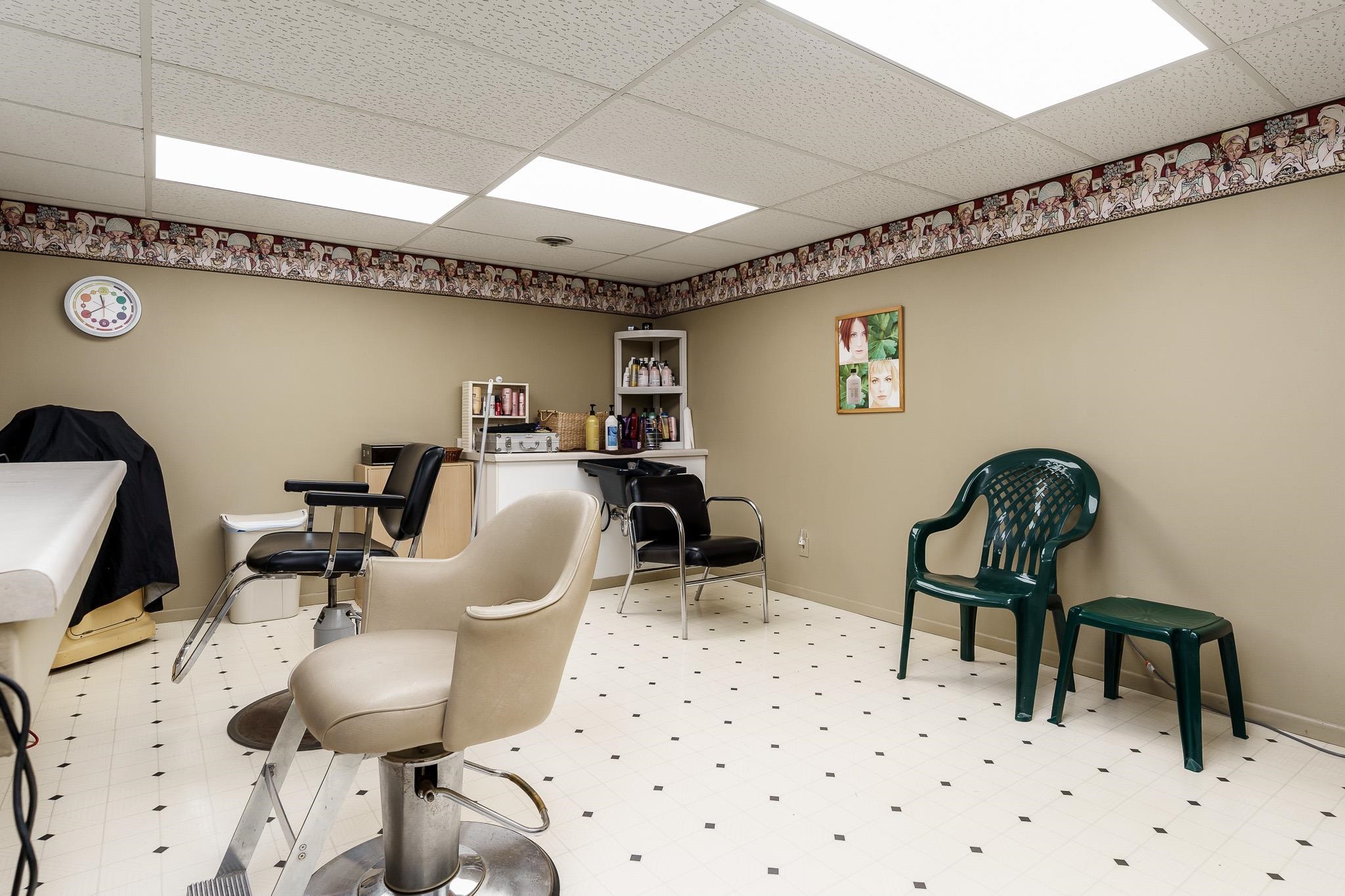 11748 Cedarbrook Road Roscoe, IL 61073 - Photo 35 of 50 a dining room with furniture and wooden floor