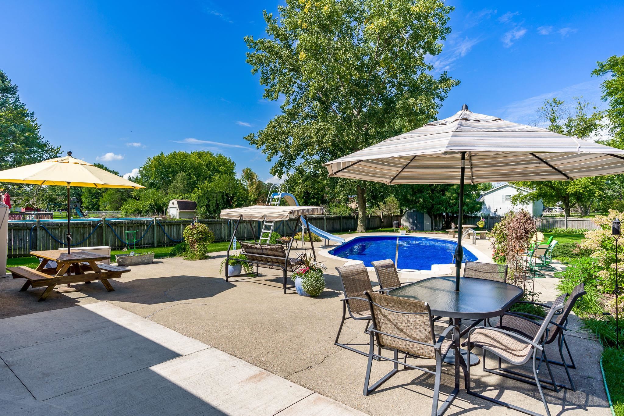 11748 Cedarbrook Road Roscoe, IL 61073 - Photo 39 of 50 a view of backyard with seating space and wooden fence