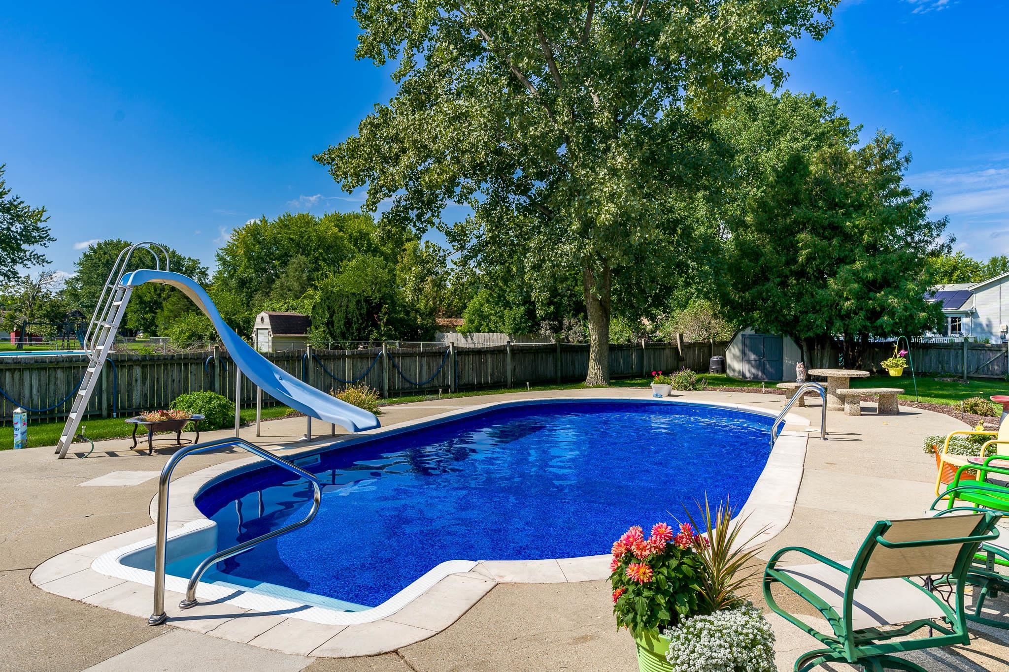 11748 Cedarbrook Road Roscoe, IL 61073 - Photo 42 of 50 a view of a swimming pool with a patio