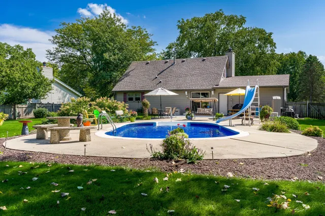 a view of a park with sitting area and slide
