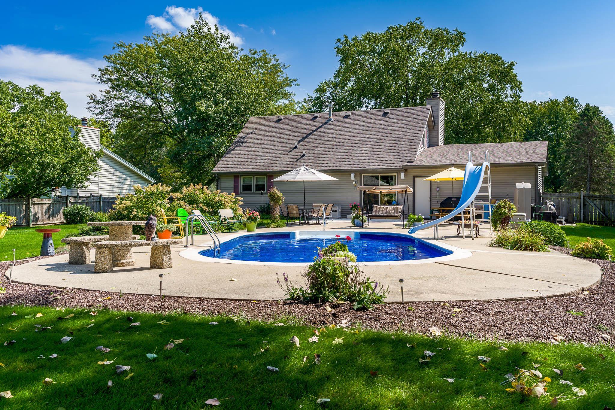 11748 Cedarbrook Road Roscoe, IL 61073 - Photo 46 of 50 a view of a house with swimming pool and a yard