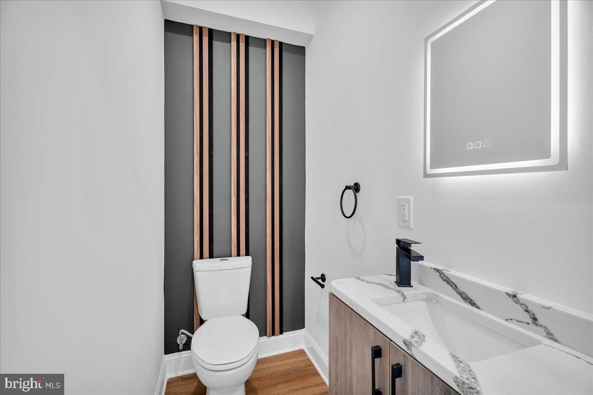 2504 Church Road Cinnaminson, NJ 08077 - Photo 25 of 79 a bathroom with a granite countertop toilet sink and mirror