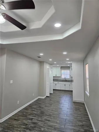 a view of kitchen and kitchen with stainless steel appliances