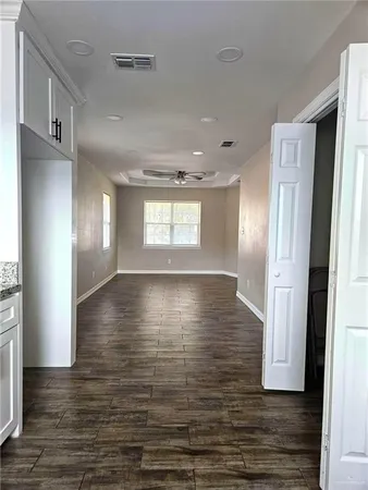 a view of a livingroom with wooden floor