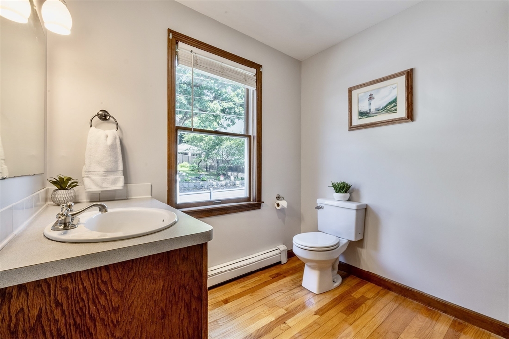41 Filbert Street Quincy, MA 02169 - Photo 12 of 42 a bathroom with a sink toilet and a mirror