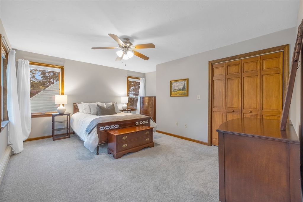 41 Filbert Street Quincy, MA 02169 - Photo 17 of 42 a bedroom with a bed lamp and a window