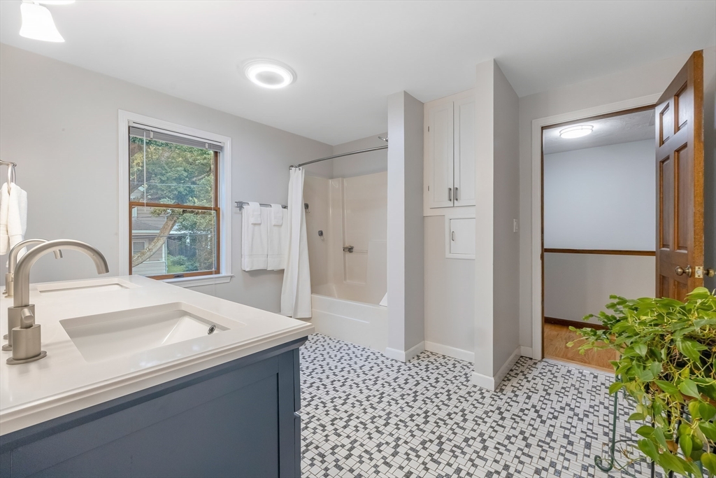 41 Filbert Street Quincy, MA 02169 - Photo 18 of 42 a kitchen with a sink a refrigerator and a window