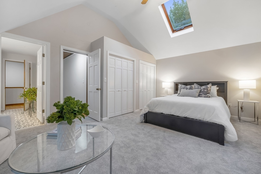 41 Filbert Street Quincy, MA 02169 - Photo 20 of 42 a spacious bedroom with a bed and a potted plant