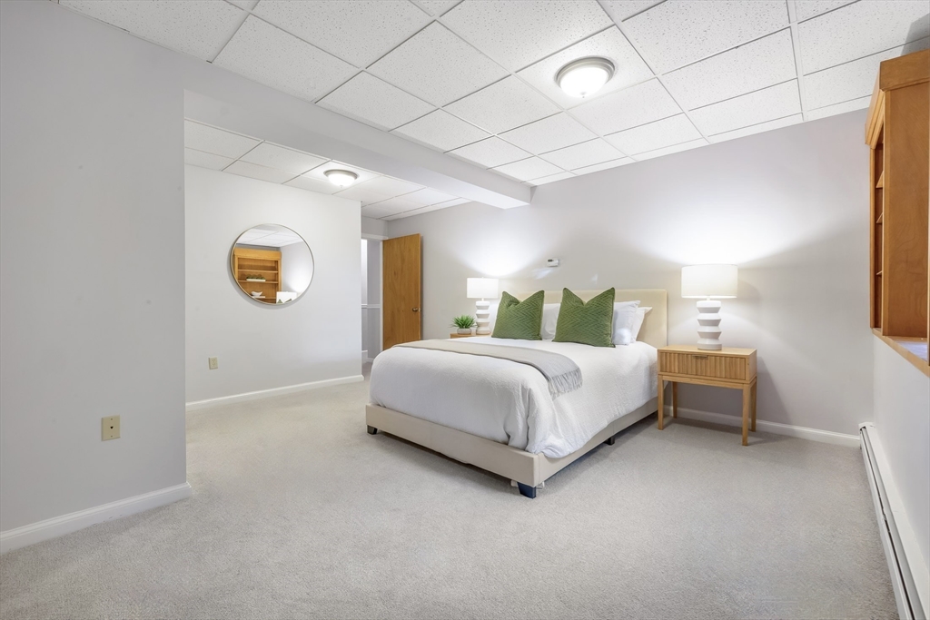 41 Filbert Street Quincy, MA 02169 - Photo 29 of 42 a spacious bedroom with a bed and a window