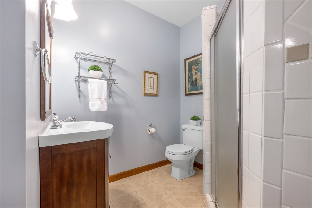 41 Filbert Street Quincy, MA 02169 - Photo 31 of 42 a bathroom with a toilet sink and mirror