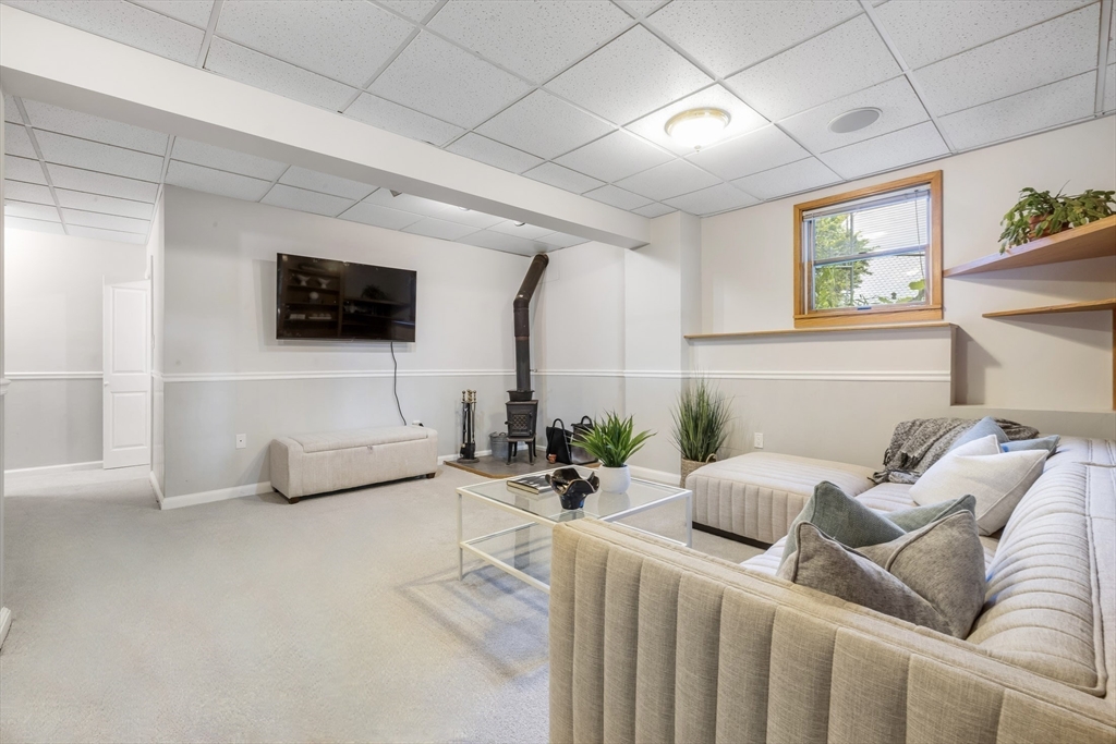 41 Filbert Street Quincy, MA 02169 - Photo 34 of 42 a living room with furniture and a flat screen tv