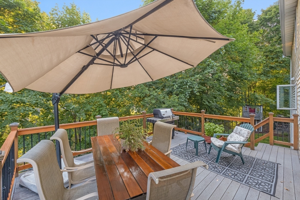 41 Filbert Street Quincy, MA 02169 - Photo 6 of 42 a view of deck with outdoor seating and wooden floor