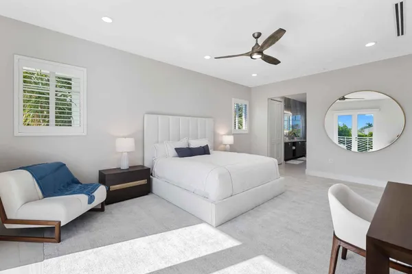 a bedroom with a bed couch and window