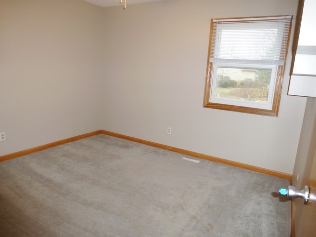 6 Crofton Road Oswego, IL 60543 - Photo 15 of 24 an empty room with a window